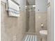 Modern bathroom with a glass-enclosed shower, neutral tile, and a clean, functional layout at 859 Napoli Ln, Punta Gorda, FL 33950