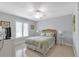 Cozy bedroom features a comfortable bed, bright windows, and a tranquil atmosphere at 859 Napoli Ln, Punta Gorda, FL 33950