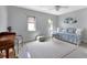 Bedroom with daybed, desk, ceiling fan, and neutral color scheme at 859 Napoli Ln, Punta Gorda, FL 33950