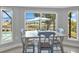 Charming breakfast nook offering serene views of the waterfront and outdoor living area at 859 Napoli Ln, Punta Gorda, FL 33950
