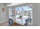 Cozy breakfast nook with views of the pool and waterfront, perfect for casual dining at 859 Napoli Ln, Punta Gorda, FL 33950