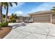 Spacious driveway leading to a well-maintained home with a two-car garage at 859 Napoli Ln, Punta Gorda, FL 33950