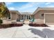 Inviting front porch with decorative chairs and a view of the home's entrance at 859 Napoli Ln, Punta Gorda, FL 33950