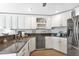Well-equipped kitchen with stainless steel appliances and ample countertop space at 859 Napoli Ln, Punta Gorda, FL 33950