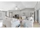 Bright living room with modern decor, tile flooring, and a comfortable seating arrangement at 859 Napoli Ln, Punta Gorda, FL 33950