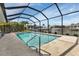 Inviting pool in screened enclosure with canal views and outdoor space at 859 Napoli Ln, Punta Gorda, FL 33950