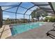 A lovely screened-in pool with plenty of space to sit and relax and views of the canal at 859 Napoli Ln, Punta Gorda, FL 33950