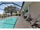 A lovely screened-in pool and patio with space for outdoor dining and relaxing at 859 Napoli Ln, Punta Gorda, FL 33950