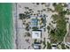Aerial view showing property lines of a beach house with direct access to a sandy beach and the Gulf at 8754 King St, Placida, FL 33946