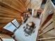 Well-lit dining room with wooden walls, a modern table, an open doorway and a decorative shelf, conveying a warm atmosphere at 8754 King St, Placida, FL 33946