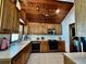 Charming kitchen featuring wood cabinets, white countertops, and tiled flooring at 8754 King St, Placida, FL 33946
