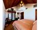 Cozy primary bedroom with a wood ceiling, sitting area, and ample natural light at 8754 King St, Placida, FL 33946