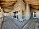 Spacious covered porch with wood floor and ceilings and views of the beach at 8754 King St, Placida, FL 33946
