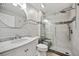Modern bathroom featuring a glass-enclosed shower, marble vanity, and stylish fixtures at 93 Vivante Blvd # 9344, Punta Gorda, FL 33950