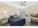 Comfortable bedroom with a ceiling fan, a full bed, and a white desk with printer at 93 Vivante Blvd # 9344, Punta Gorda, FL 33950