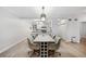Dining area adjacent to the kitchen with seating for six and contemporary lighting at 93 Vivante Blvd # 9344, Punta Gorda, FL 33950