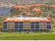 Exterior of condo building showing multiple floors with balconies and an orange tile roof at 93 Vivante Blvd # 9344, Punta Gorda, FL 33950
