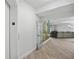 Hallway leading to a unit with a mural on the wall and a view of the living room at 93 Vivante Blvd # 9344, Punta Gorda, FL 33950