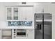 Bright kitchen with stainless steel appliances, quartz countertops and tile backsplash at 93 Vivante Blvd # 9344, Punta Gorda, FL 33950