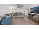 Open living area with modern furnishings, hardwood flooring and views to the kitchen at 93 Vivante Blvd # 9344, Punta Gorda, FL 33950