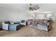 Open living area with modern furnishings, hardwood flooring and views to the kitchen at 93 Vivante Blvd # 9344, Punta Gorda, FL 33950