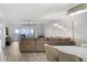 Spacious living room with a large sectional sofa, a view of the ocean and contemporary lighting at 93 Vivante Blvd # 9344, Punta Gorda, FL 33950