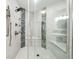 Walk-in shower with dual shower heads and seating in a bright modern bathroom at 93 Vivante Blvd # 9344, Punta Gorda, FL 33950