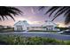 Stunning new clubhouse with a white exterior, metal roof, and lush landscaping, perfect for community gatherings at 12857 Pinnacle Ln, Venice, FL 34293