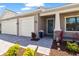 Charming home exterior featuring a well-manicured lawn, lush landscaping, and a welcoming front entrance at 12857 Pinnacle Ln, Venice, FL 34293