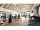 Bright and airy gym with state-of-the-art exercise equipment, herringbone floors, and a variety of workout options at 12857 Pinnacle Ln, Venice, FL 34293