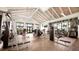 Well-equipped gym featuring modern exercise machines, herringbone floors, high ceilings, and plenty of natural light at 12857 Pinnacle Ln, Venice, FL 34293