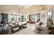 Spacious lounge area with contemporary furnishings, high ceilings, and large windows offering ample natural light at 12857 Pinnacle Ln, Venice, FL 34293
