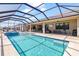A beautiful screened-in pool with ample patio space for outdoor lounging and entertainment at 12857 Pinnacle Ln, Venice, FL 34293