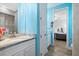 Bathroom featuring double vanity with granite countertops and a bathtub at 13443 Boabadilla Ln, Port Charlotte, FL 33981