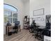 Spacious home office with desk and lots of natural light with wood floors at 13443 Boabadilla Ln, Port Charlotte, FL 33981