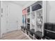 Mudroom with individual storage lockers, shelving, a bench, coat hooks, and a Primo water dispenser at 13443 Boabadilla Ln, Port Charlotte, FL 33981