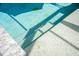 Pool steps with turtle mosaic tile create a whimsical and inviting entry into cool water at 13443 Boabadilla Ln, Port Charlotte, FL 33981