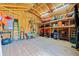 Interior of a well-organized shed with wooden floors and storage for tools and equipment at 13443 Boabadilla Ln, Port Charlotte, FL 33981