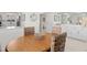 Dining room with an oval table and four chairs across from the kitchen at 1345 Mediterranean Dr # A105, Punta Gorda, FL 33950