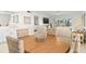 Dining room with an oval table and four chairs overlooking the living room and waterfront at 1345 Mediterranean Dr # A105, Punta Gorda, FL 33950