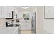 Bright kitchen featuring white cabinets, stainless steel appliances, and modern countertops at 1345 Mediterranean Dr # A105, Punta Gorda, FL 33950