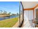 Relax in the lanai with stunning views of the canal and tropical landscaping at 1345 Mediterranean Dr # A105, Punta Gorda, FL 33950