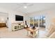 Stylish living room with views, comfortable seating and tile flooring at 1345 Mediterranean Dr # A105, Punta Gorda, FL 33950