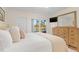 Comfortable main bedroom with access to a balcony that overlooks a stunning waterfront at 1345 Mediterranean Dr # A105, Punta Gorda, FL 33950
