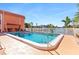 Inviting community pool with crystal-clear water and comfortable seating area near the water at 1345 Mediterranean Dr # A105, Punta Gorda, FL 33950