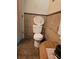 Toilet in the bathroom has a decorative lid and tile on the wall at 1457 Sheehan Blvd, Port Charlotte, FL 33952