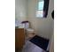 Functional bathroom with a toilet, vanity, and a window for natural light at 1457 Sheehan Blvd, Port Charlotte, FL 33952