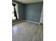 Bedroom with wood look floors and window at 1457 Sheehan Blvd, Port Charlotte, FL 33952