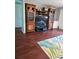 Inviting living area with wood flooring, a decorative rug, and a built-in entertainment center at 1457 Sheehan Blvd, Port Charlotte, FL 33952