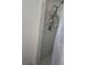 Compact shower with tile surround and shelving for toiletries in a well-maintained bathroom at 1457 Sheehan Blvd, Port Charlotte, FL 33952